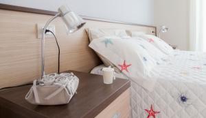 Postel nebo postele na pokoji v ubytování Residenze Roscioli