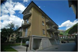 a tall building with balconies on the side of it at Residence Giuliana Dervio in Dervio