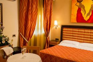 Postel nebo postele na pokoji v ubytování Hotel Ares