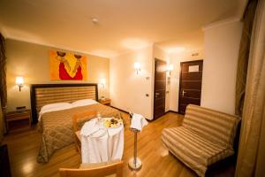 Postel nebo postele na pokoji v ubytování Hotel Ares