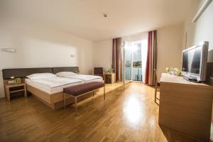 TV o dispositivi per l'intrattenimento presso Hotel Garni Toscanina - Adults Only