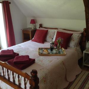 Кровать или кровати в номере Le Bourg Remy Gites