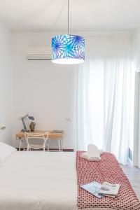 Posteľ alebo postele v izbe v ubytovaní Nonna Pina Art Rooms