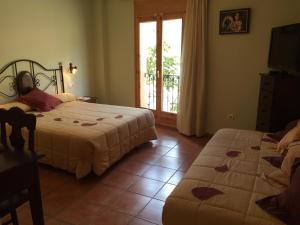 Postel nebo postele na pokoji v ubytování Hotel Castellote