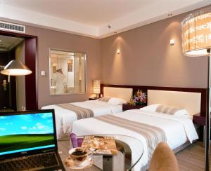 Cama o camas de una habitación en Beijing Tibet Hotel