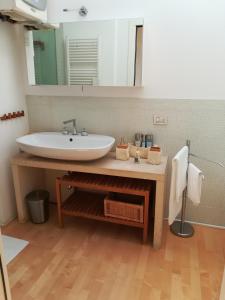 a bathroom with a sink and a mirror at Residenza San Pietro in Vicenza