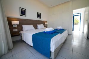 A bed or beds in a room at Marica's Boutique Hotel