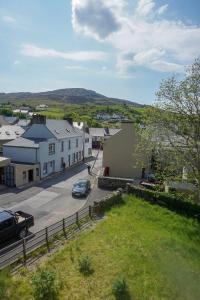 a view of a town with a car parked in the street at Kilcar Lodge in Kilcar