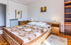 a bedroom with a large bed in a room at Three-Bedroom Apartment Meden in Pomer