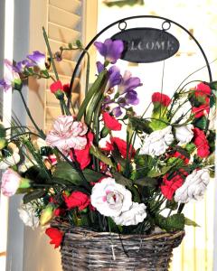 a basket filled with flowers on a table at ELENI'S NEOCLASSICAL HOME in Athens