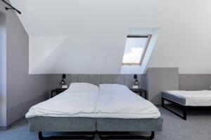 
Łóżko lub łóżka w pokoju w obiekcie Pensjonat Kocius
