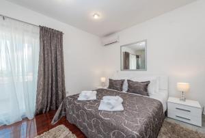 Krevet ili kreveti u jedinici u objektu Apartments Very Good Life
