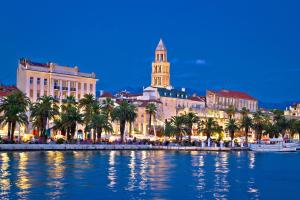 a view of a city with palm trees and buildings at Bozikovic 365 in Podstrana