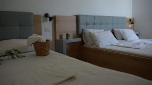 Postel nebo postele na pokoji v ubytování Hotel Ionian