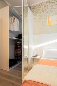 A bed or beds in a room at Hotel Ombretta Mare