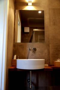 a bathroom with a white sink and a mirror at Cerasus B&B in San Marcello +19 photos