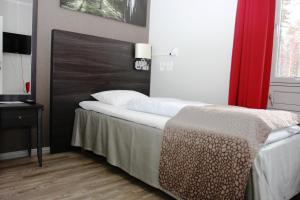 Postel nebo postele na pokoji v ubytování Sørmarka Konferansehotell