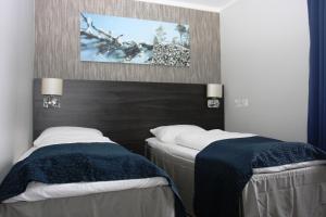 Postel nebo postele na pokoji v ubytování Sørmarka Konferansehotell
