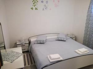 מיטה או מיטות בחדר ב-Apartment Vesna