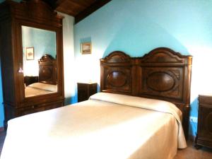 Giường trong phòng chung tại Cortebella B&B Rimini