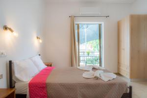 Postel nebo postele na pokoji v ubytování Stellar Apartments I