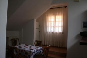 a dining room with a table and a window at Studio in Selínia