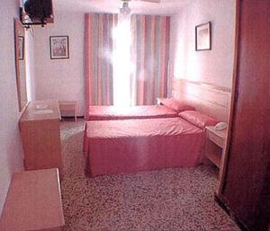 Postel nebo postele na pokoji v ubytování Hotel Iris