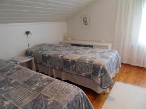 Postel nebo postele na pokoji v ubytování Riverhouse Lumo