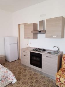 Kuchyň nebo kuchyňský kout v ubytování Sea Salento Casa Vacanze