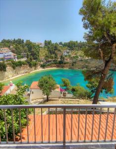 a view of a lake from a balcony at Magdalini in Votsi