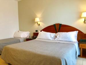 Postel nebo postele na pokoji v ubytování Ariae Dépendance - Alihotels