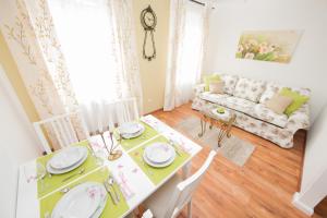 a dining room with a table and a couch at Traditional Apartments Vienna TAV - Entire in Vienna