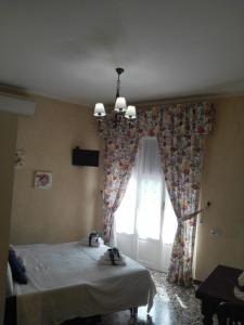 Postel nebo postele na pokoji v ubytování Affittacamere Da Carla