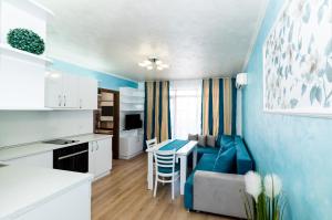 a kitchen and living room with a couch and a table at Stela Apartments in Obzor +61 photos