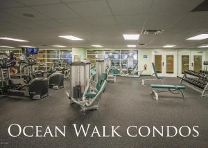 a gym with treadmills and machines in a room at Ocean Walk Resort 905 in Daytona Beach