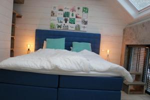 Postel nebo postele na pokoji v ubytování B&B de Petrakerk