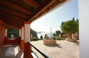 a view from the balcony of a house at Paleopalace in Paleokastritsa