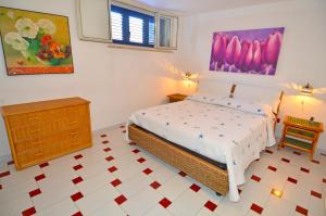 Ένα ή περισσότερα κρεβάτια σε δωμάτιο στο Casa Tramonto - RosariaVacanze