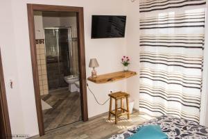 a bathroom with a sink and a toilet in a room at B&B Geolja in Gioia Tauro