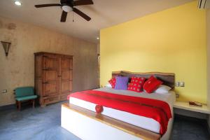 En eller flere senge i et værelse på Corazon De Jade Tulum