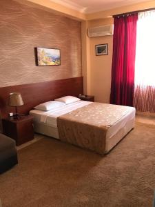 Letto o letti in una camera di Hotel Condori