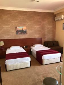 Letto o letti in una camera di Hotel Condori