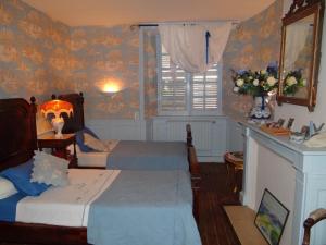 Cama ou camas em um quarto em Domaine de la Dame de Laurière