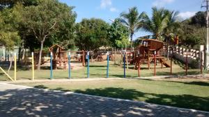a park with a playground with a slide at Prainha Aconchegante apto de quarto e sala com vista para o mar in Arraial do Cabo