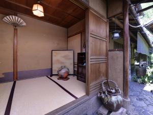 Postel nebo postele na pokoji v ubytování Ryokan Inakatei