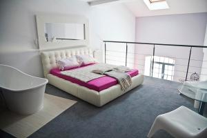 Postel nebo postele na pokoji v ubytování Loft Suite