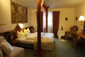 En eller flere senge i et værelse på Hotel Villa Brenner