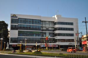 a building with a van parked in front of it at Days Hotel by Wyndham Iloilo in Iloilo City