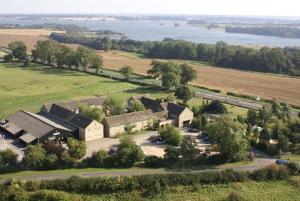 an aerial view of a house in a field at The Barnsdale, Rutland in Oakham