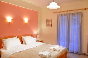 Voodi või voodid majutusasutuse Hotel Patelis toas